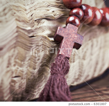 wooden rosary and the Bible 6301807