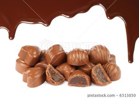 Melted chocolate dripping with candies Melted chocolate dripping with candies 6313850