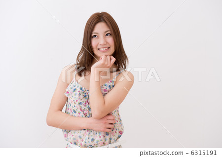 A woman in a cami dress 6315191