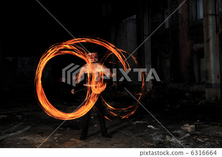 Woman holds in his hand the fire 6316664