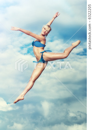Young slim woman jumping Young slim woman jumping 6322205