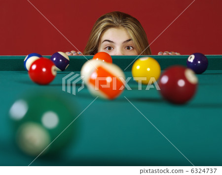 Checking for a shot while playing pool 6324737