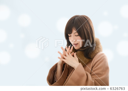 A woman in a coat 6326763