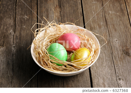 Colored easter eggs in nest 6327368