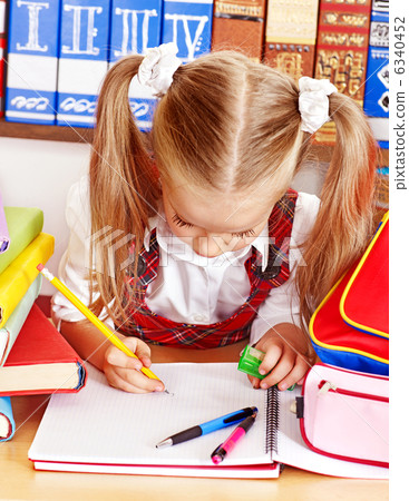 Child with stack book. 6340452