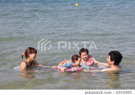 Family playing in the sea Family playing in the sea 6343965