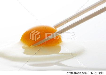 Grab egg yolk with chopsticks Grab egg yolk with chopsticks 6346390
