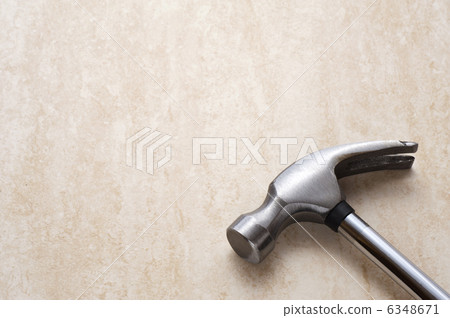 Close-up of a hammer on a stone background 6348671