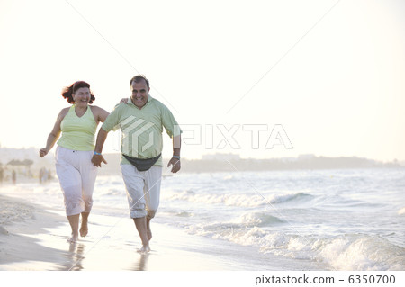 happy seniors couple on beach happy seniors couple on beach 6350700