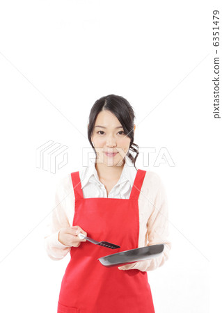 Young woman cooking with frying pan 6351479