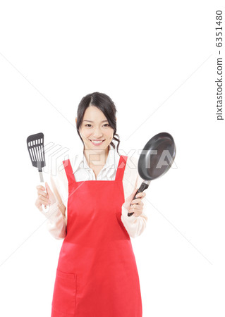Young woman cooking with frying pan 6351480