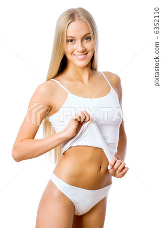 Slim tanned woman's figure. 6352110