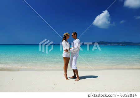 Couple in white on a beach 6352814