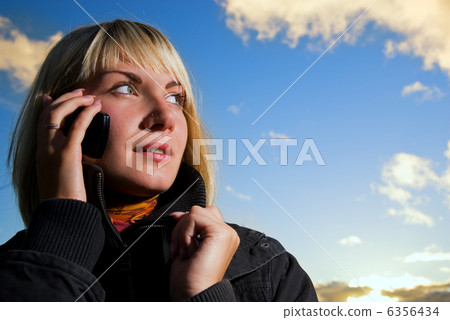Blonde girl talking on the cell phone Blonde girl talking on the cell phone 6356434