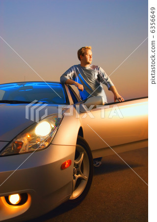 Handsome guy near the modern sport car 6356649