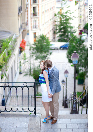 Beautiful romantic couple at the stairs on Montmartre in Paris 6358461