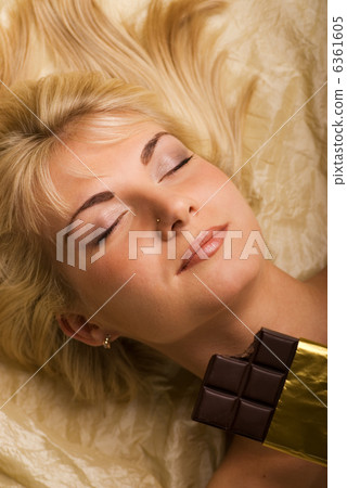 Beautiful girl eats chocolate 6361605