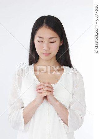 A woman praying A woman praying 6377616