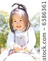 A girl playing in the park 6386361