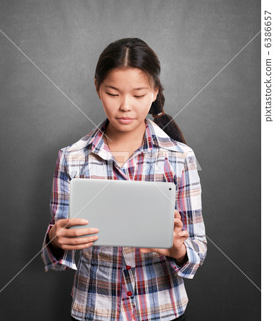 Asian Girl With Touch Pad Asian Girl With Touch Pad 6386657