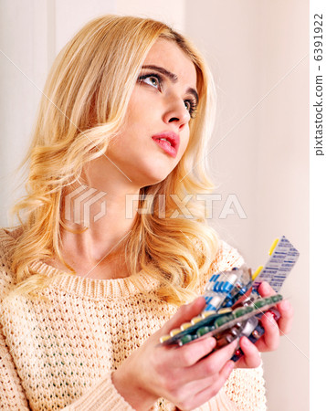 Woman having pills and tablets. 6391922