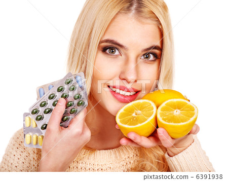 Woman having tablets and lemon. Woman having tablets and lemon. 6391938