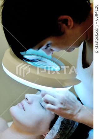 woman with facial mask in cosmetic studio woman with facial mask in cosmetic studio 6394120