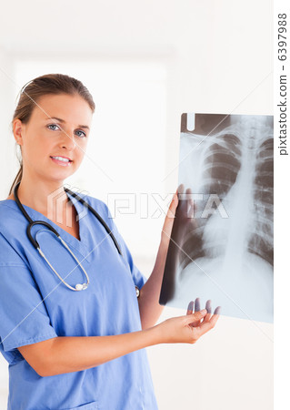 Gorgeous brunette doctor with stethoscope and x-ray 6397988