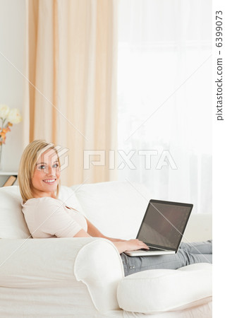 Portrait of a blond-haired woman with a notebook 6399073