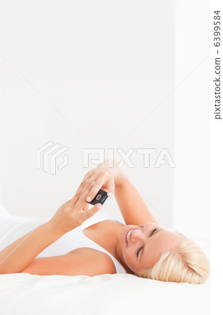 Portrait of a woman using her phone Portrait of a woman using her phone 6399584