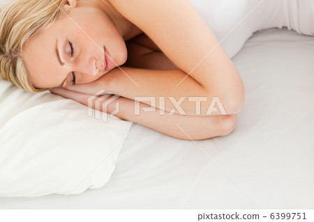 Calm blonde woman sleeping 6399751