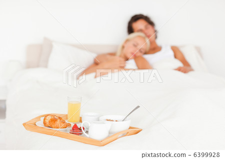 Cute couple with the breakfast put on a tray Cute couple with the breakfast put on a tray 6399928