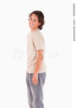 Smiling man looking into the camera Smiling man looking into the camera 6400084