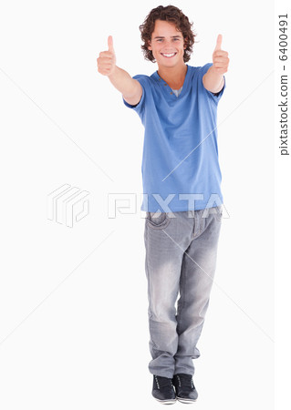 Handsome man holding thumbs up Handsome man holding thumbs up 6400491
