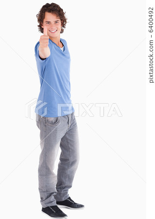 Handsome guy holding thumb up Handsome guy holding thumb up 6400492