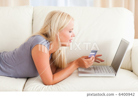Beautiful woman purchasing online Beautiful woman purchasing online 6400942