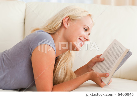 Smiling woman reading a book Smiling woman reading a book 6400945