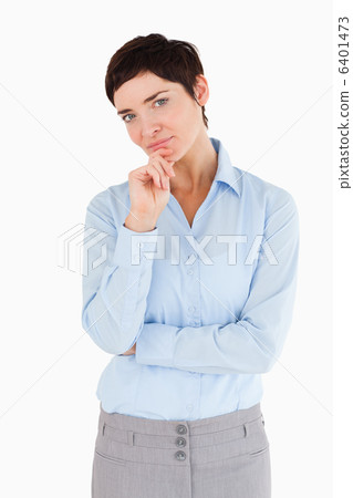 Businesswoman with her hand on her chin 6401473