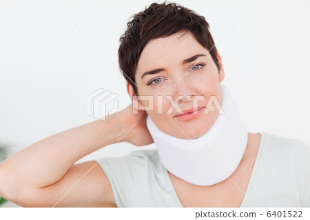 Close up of a woman with a surgical collar 6401522
