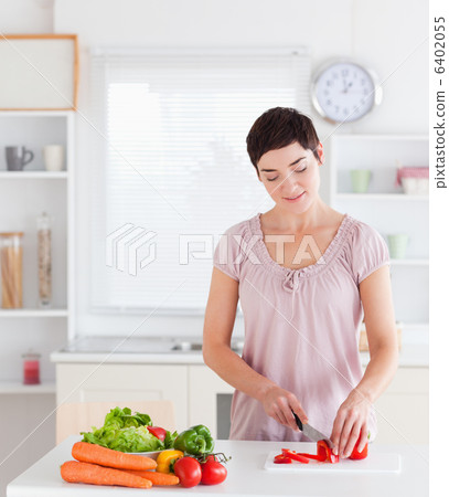 Gorgeous woman cutting vegetables 6402055