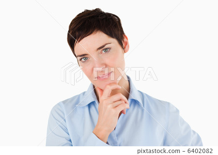 Close up of a businesswoman with her hand on her chin 6402082