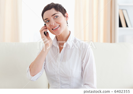 Joyful woman with a cellphone 6402355
