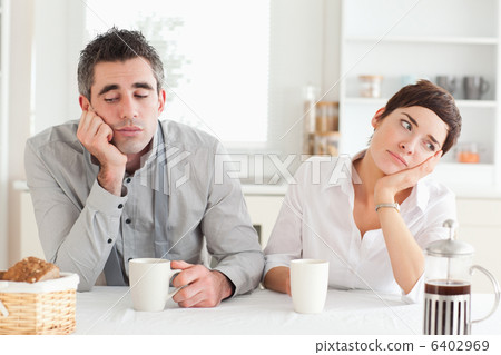 Unhappy couple drinking coffee 6402969
