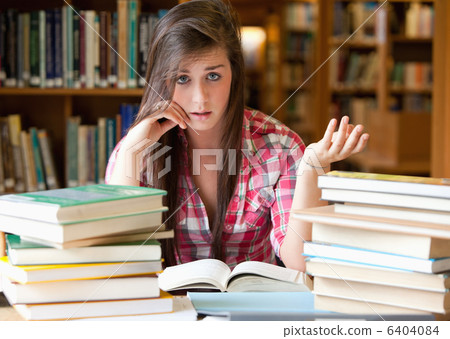 Disappointed student having a lot to read 6404084