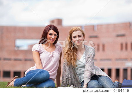 Young students with a book 6404446