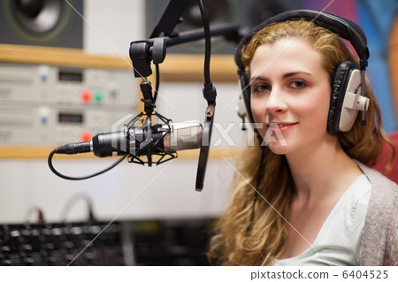 Young woman posing with a microphone Young woman posing with a microphone 6404525