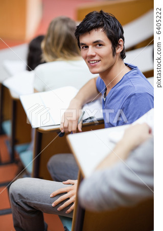 Portrait of a handsome young student being distracted 6405222