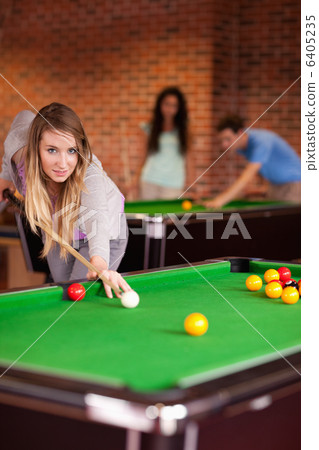 Portrait of a student woman playing snooker 6405235