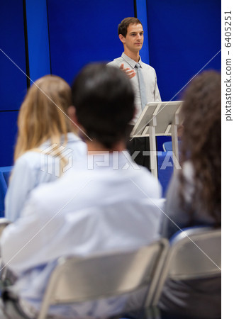 Portrait of a young man doing a presentation 6405251
