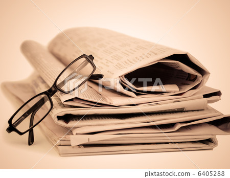 Newspapers and black glasses 6405288